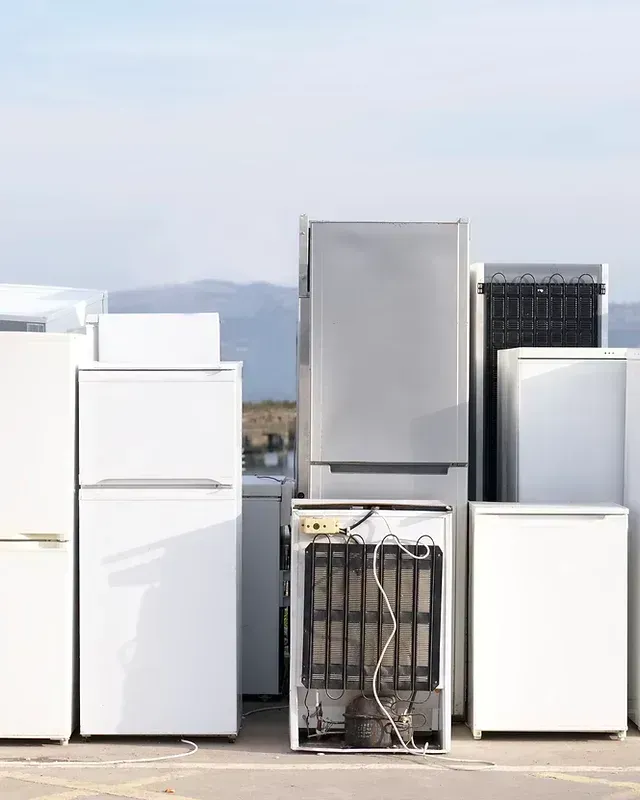 Old refrigerators and other appliances awaiting disposal